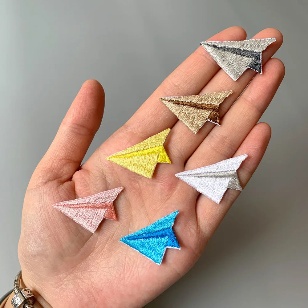 Choose from Colorful paper airplane iron-on patches