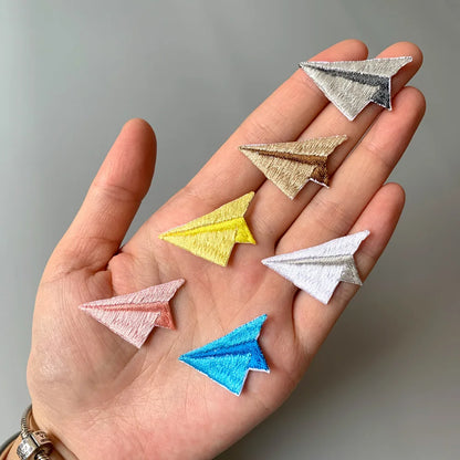 Choose from Colorful paper airplane iron-on patches