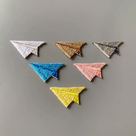 Choose from Colorful paper airplane iron-on patches